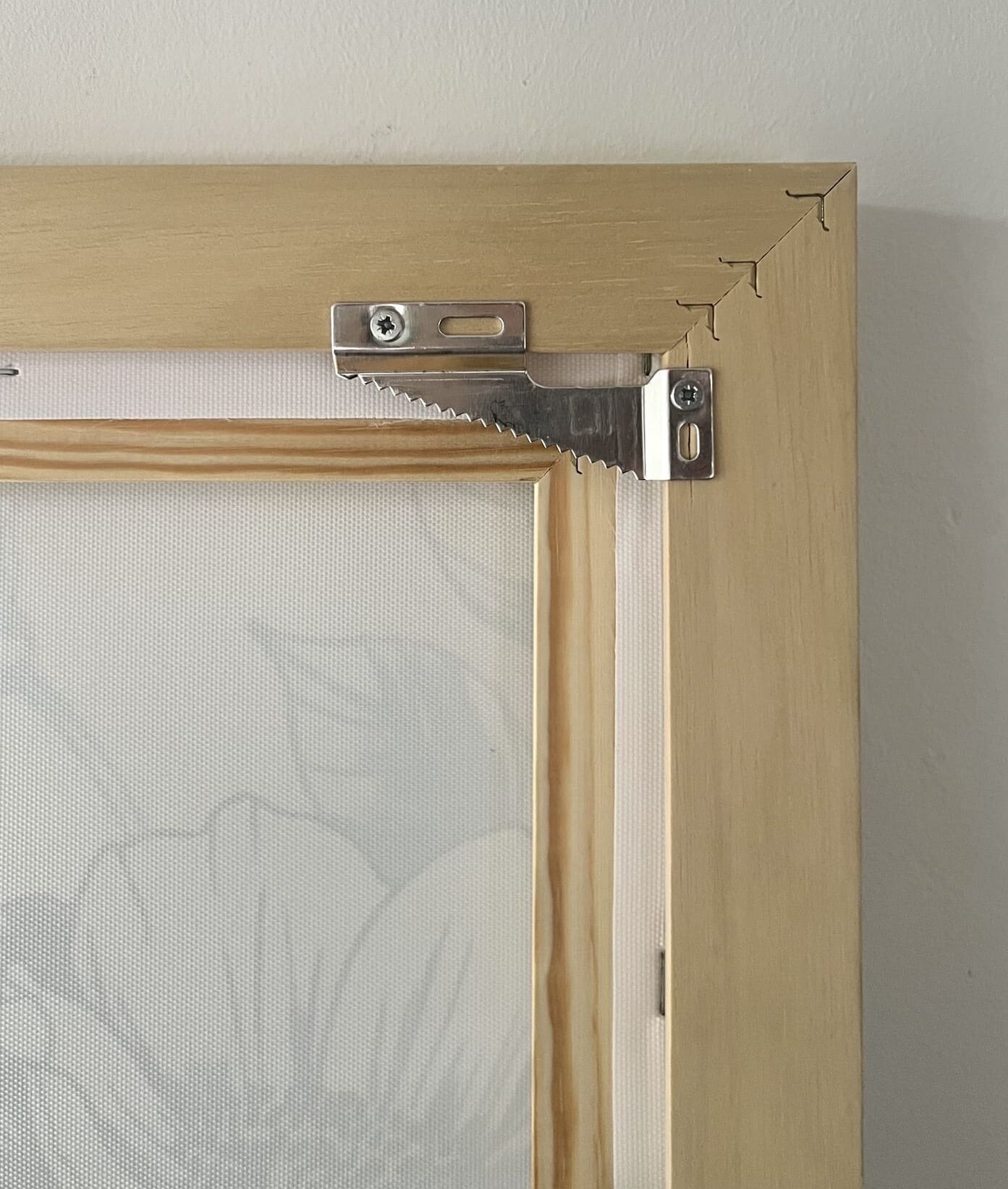 Sirious artwork canvas ophangsysteem bovenin in hoeken.